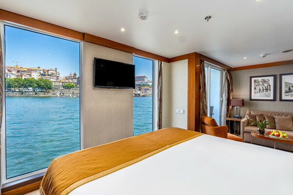 Amawaterways AmaVida Suite Bedroom and Lounge 1 ©Bruno Barreira & Amawaterways.jpeg